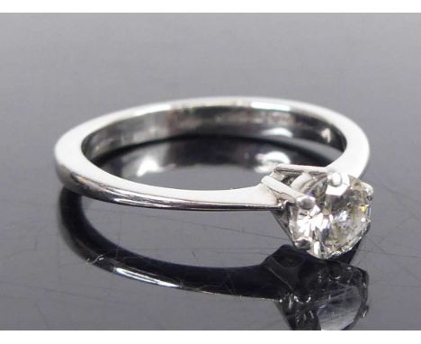 An 18ct white gold diamond solitaire ring, comprising a round brilliant cut diamond in six-claw setting, diamond diameter app