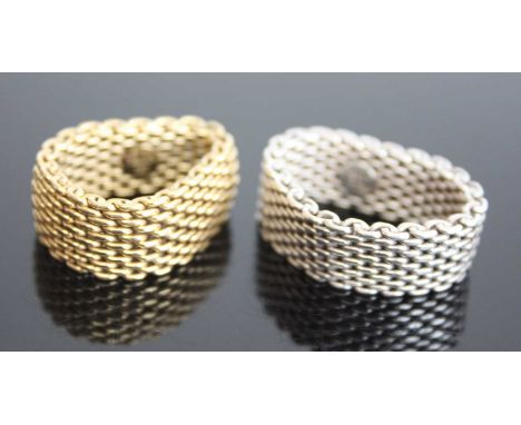Two marked Tiffany &amp; Co rings. One yellow metal 10mm wide mesh link ring, finger size T approx. Gross weight 13.3g, stamp