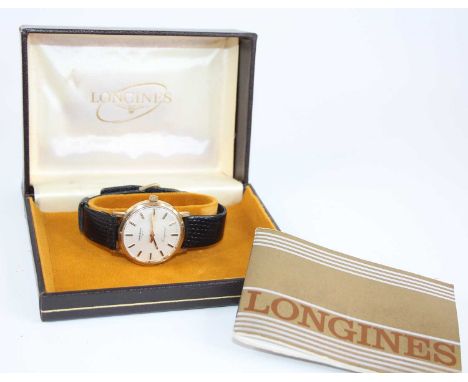 A bi-metal Longines Conquest manual wind wristwatch, having a round cream baton dial, the case back engraved 'Frigoscandia 15