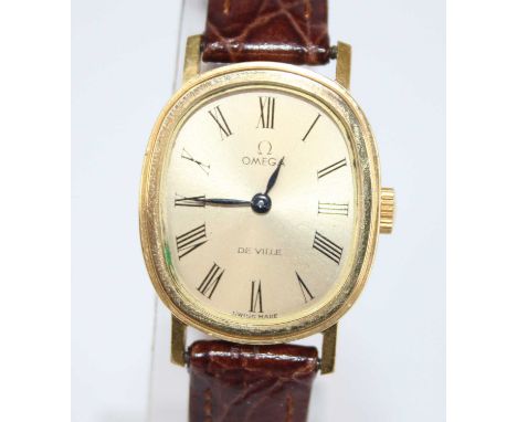 A lady's Omega De Ville gold plated wristwatch, having a gilded signed Roman dial, manual wind movement, stainless steel back