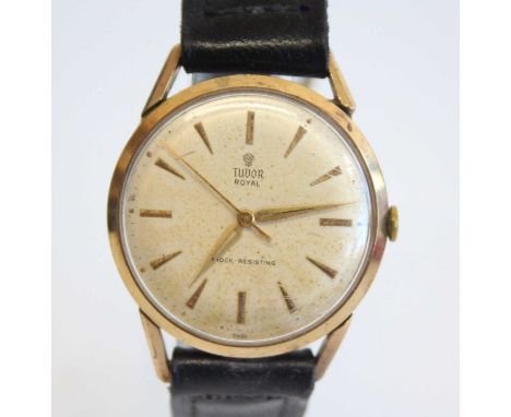 A gent's Tudor Royal 9ct gold cased manual wind wristwatch, circa 1960s, having a signed champagne dial (discoloured) with ba