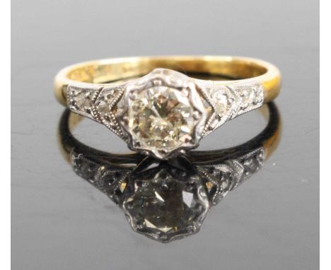 An 18ct gold diamond solitaire ring, the tinted illusion set round cuts weighing approx 0.4ct, 2.5g, size K