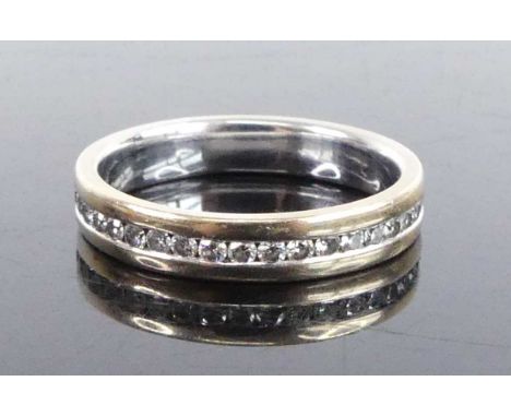 An 18ct white gold diamond full hoop eternity ring, featuring 39 round brilliant cut diamonds in channel settings, diamond di