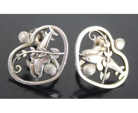 A pair of Georg Jensen sterling silver earrings designed by Arno Malinowski, each of heart shape set with twin dolphins, havi