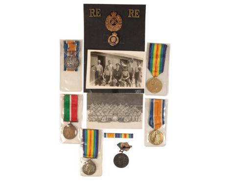 A COLLECTION OF GREAT WAR MEDALS Pair to 305165 PNR C J Smith RE with badges and two photographs. GVFMercantile Marine Medal 