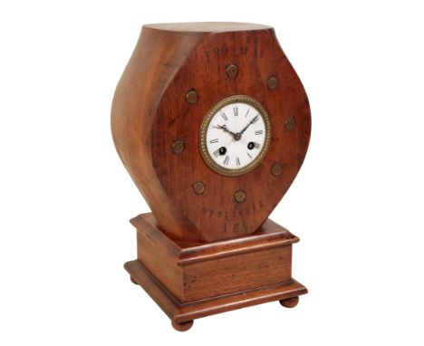 A FIRST WORLD WAR PROPELLOR BOSS in the form of a mantel clock with key-wind movement, the white enamel dial with black Roman