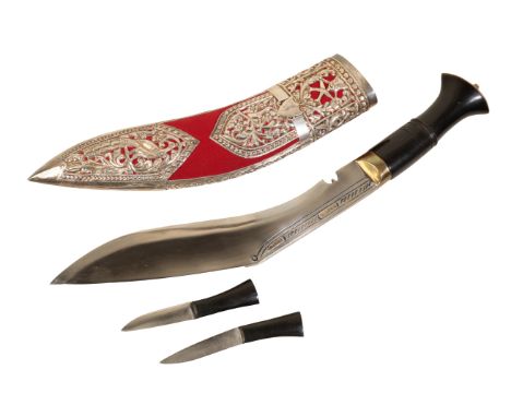 A LATE 19TH CENTURY KUKRI with white metal and velvet scabbard, with embossed floral decoration of birds and flowers, ebony h