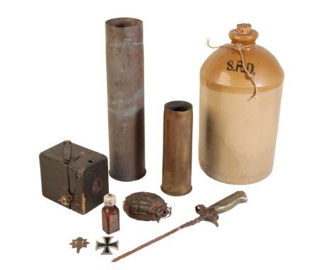 A DEVONSHIRE  REGIMENT BADGE, a German Military Cross, two military brass shells, a French bayonet, an S.R.D. jar and other i