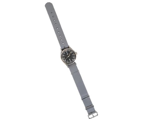AN OMEGA GENTLEMAN'S MILITARY  STAINLESS STEEL WRISTWATCH with manual wind movement, the black dial with luminous Arabic nume