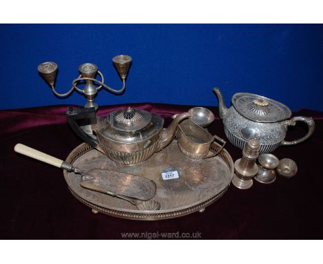 An oval galleried silver plate Tray, two plated teapots, candelabra, sifter, cream jug, etc.