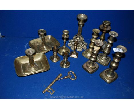 Twelve old Brass Candlesticks and a novelty key shaped Corkscrew