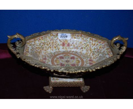 A ceramic Centrepiece with brass rim, handles and feet