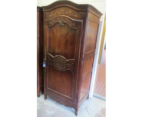 BONNETIERE, French Louis XV manner cherrywood with an arched cornice, foliate carved decoration and a single panelled door en