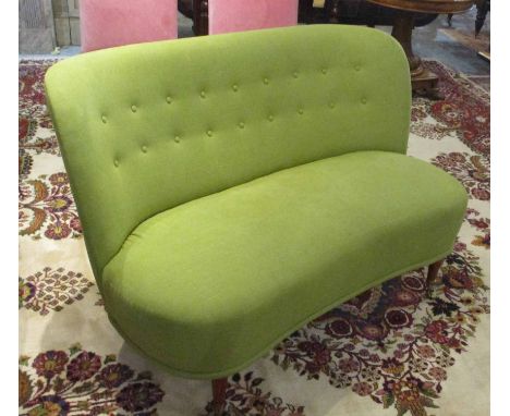 SOFA, circa 1960's with a buttoned, curved back and lime green upholstery on short turned front supports with cappings and ca