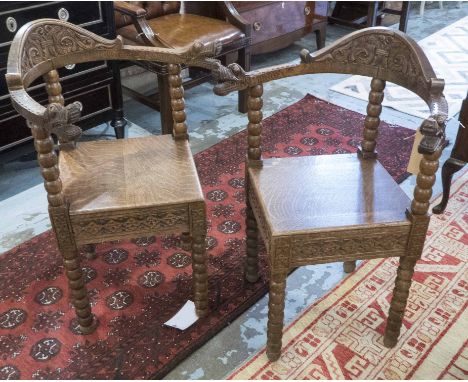CORNER CHAIRS, a pair, late 19th century continental carved oak with arms terminating in animal detail on bobbin turned suppo
