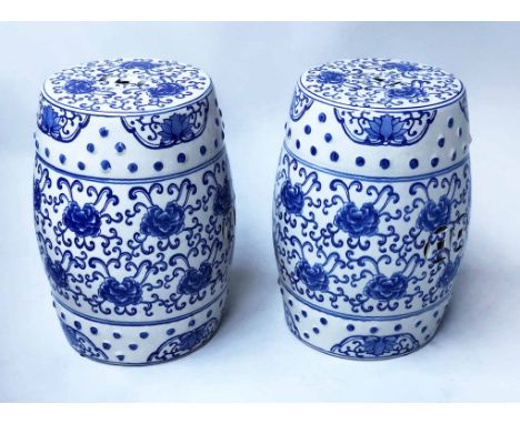 STOOLS, a pair, Chinese blue and white ceramic of barrel form and pierced detail, 46cm H. (2)