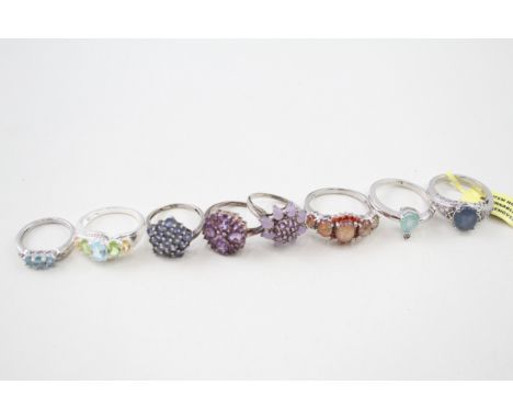 A collection of gemstone rings including opal and amethyst (32g) 
