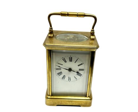 Large brass striking carriage clock measures approx 13.2cm hight 8.3cm wide the clock is not ticking 