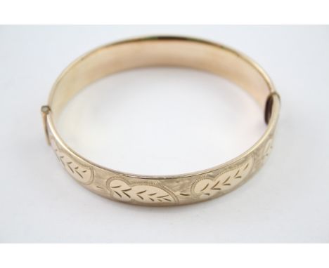 Rolled gold bangle with scrolling foliate design 1/5th (25g) 
