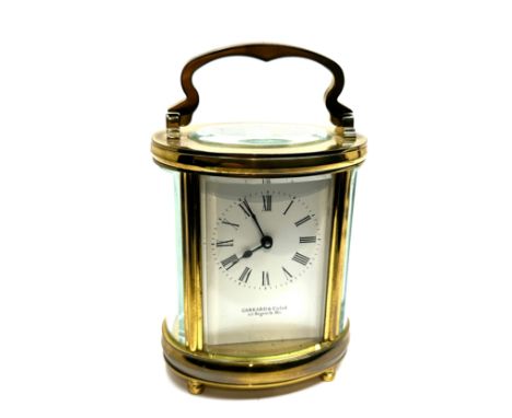 Garrard &amp; co Ltd brass carriage clock the clock is in working order measures approx 11cm high not including handle bowded