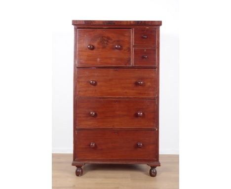 A VICTORIAN MAHOGANY CHEST OF DRAWERSa large 'hat box' top drawer with two small adjacent drawers, with three long drawers be