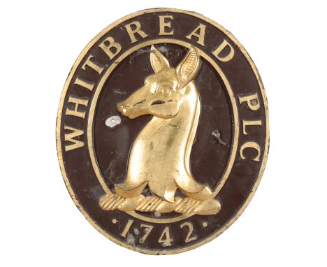 A GILDED WOODEN WHITBREAD PLC WALL PLAQUE44cm high x 38cm wide x 2.5cm deep; together with other beer ephemera, including a T