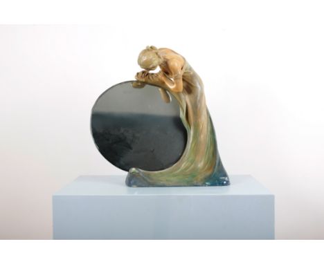 A LARGE ART DECO PLASTER FIGURE OF A LADY OR NYMPH ADMIRING HER REFLECTION IN THE MIRRORin Art Nouveau style with chignon and