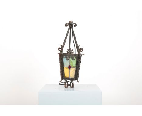 A STAINED AND ETCHED GLASS HALL LANTERN late 19th or early 20th century, with wrought iron frame, 60cm high x 22cm long x 22c