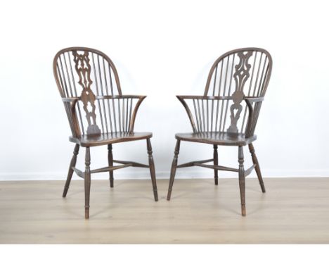 TWO SIMILAR ASH AND ELM TWO TIER STICK BACK ARMCHAIRSof 19th century design, with pierced splats, back rail, on turned legs, 