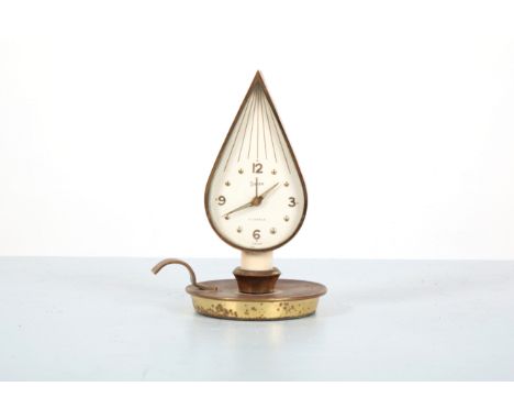 SWIZA OF SWITXERLAND: A BRASS CHAMBER STICK 'FLAME' ALARM CLOCKcirca 1950, 14cm high x 8cm diameter (excluding handle)