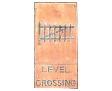 A CAST IRON RAILWAY 'LEVEL CROSSING' SIGNwith raised black lettering, 58.5cm high x 29cm wide