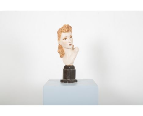 A 1940S PLASTER SHOP MANNEQUIN BUST WITH 'POMPADOUR' HAIRSTYLErealistically modelled with strawberry blonde curls and 'make-u