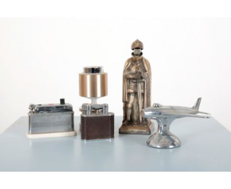 A DUNHILL NOVELTY CHROME 'SABRE' JET PLANE TABLE LIGHTERafter a 1954 F-86 Sabre jet plane, 8cm high x 16cm long x 15cm deep; 