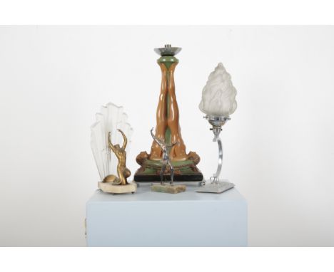 THREE ART DECO TABLE LIGHTS one of a spelter lady with outstretched arms before opaque glass 'sunray' shade on marble plinth,