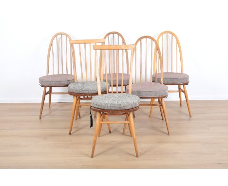 ERCOL, MODEL 365: FOUR BEECH AND ELM 'WINDSOR DINING CHAIRSmid-century modern; together with another two chairs by Ercol, Mod