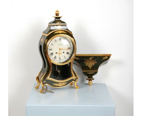 A ZENITH BRACKET CLOCKmodern, of waisted design with simulated olive marble ground and painted gilded flowers, terminating on