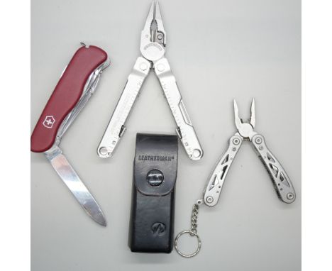 Three multi-tool penknives, including one Leatherman and one Victorinox *THIS LOT IS NOT AVAILABLE FOR PACKING AND POSTING