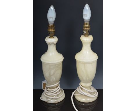 Pair of alabaster vase shape lamp bases, 32cm and a pair of brass table lamps, each with twin branches (4).