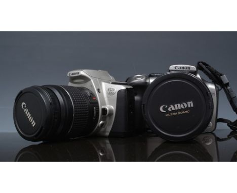 Canon Eos 300D digital camera, with a zoom lens, a Canon Eos 300 camera and a Mamiya ZE camera, other cameras and photographi