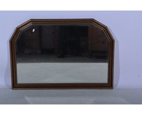 Reproduction simulated yew wood overmantel mirror, bevelled plate, width 102cm, a framed photographic portrait of a baby and 