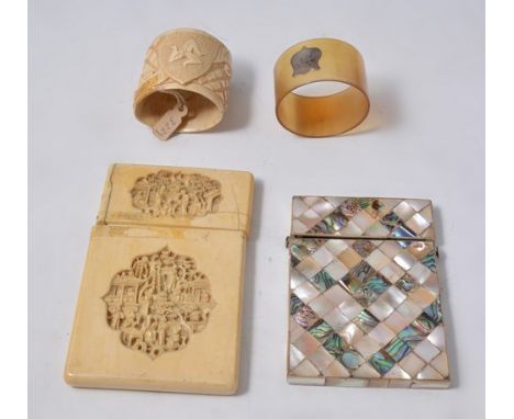 Set of six horn napkin rings, with white metal cartouches, a bone manx napkin ring, mother of pearl and abalone visiting card