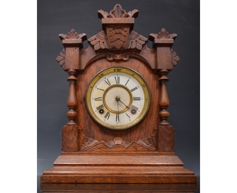 Oak cased mantel clock, triangular pediment piece, labelled Eight Day Tivoli Strike, Ansonia Clock Company, New York, 38cm.