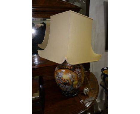 Pair of modern Far East porcelain lamp bases, of bulbous form, with shades, 62cm overall.
