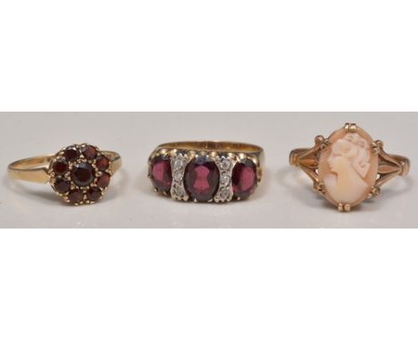 9ct hallmark gold garnet cluster ring, another 9ct hallmark gold cluster ring and a 9ct cameo ring (3).