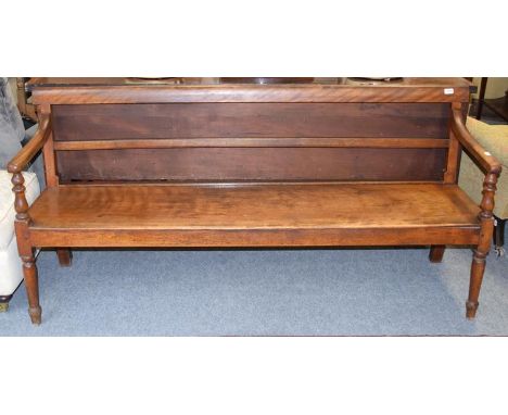 A Regency mahogany bench raised on turned supports, 183cm by 50cm by 87cm 