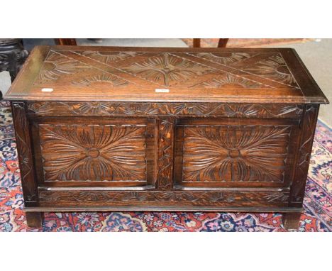A 20th century carved oak two panel coffer, 90cm by 42cm by 48cm 