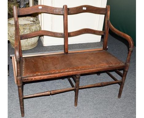 An early 20th century oak bench, 108cm by 51cm by 93cm