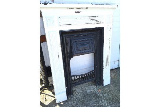 An Edwardian Cast Iron Chimneypiece With Ribbed Panels Around The