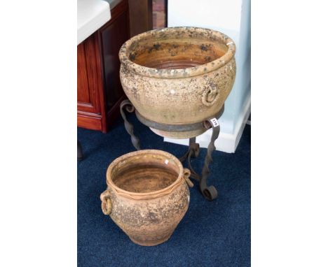 A Terracotta planter on iron base, height 61cm, together with smaller one (2).