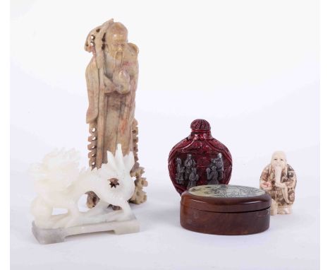 A 20th century carved green hardstone Chinese figure, 15cm, a carved modern hardstone dragon scent bottle, Netsuke and a smal